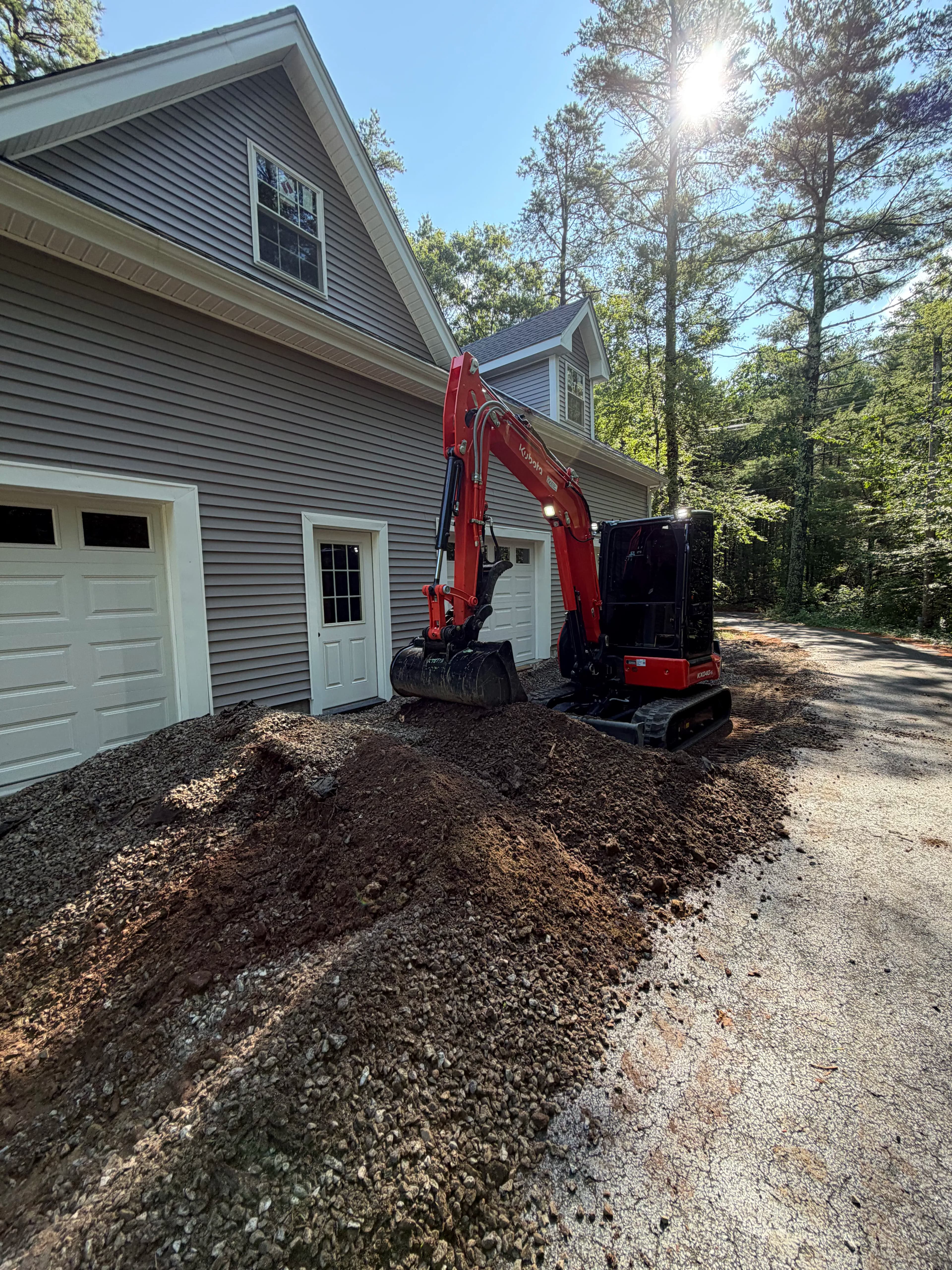 Project Garage Apron Regrind and Stone Wall Fixes a Drainage Problem image