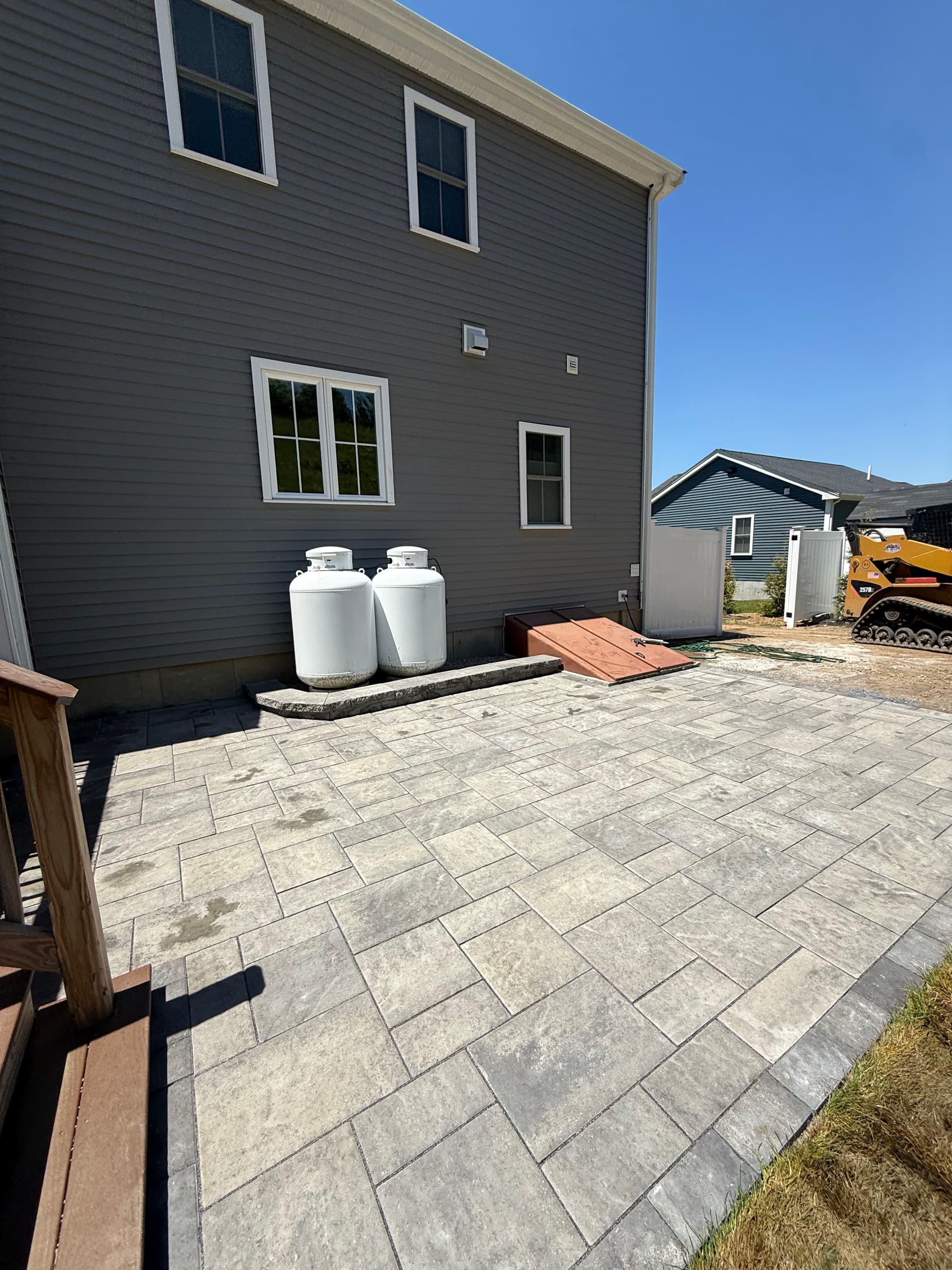 Bare Dirt Backyard Gets a Techo-Bloc Blu 60 Paver Patio