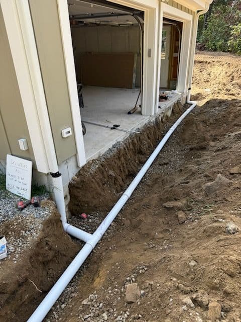 Drainage Solutions and Temporary Driveway Installation for Renovated Home