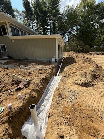 Drainage Solutions and Temporary Driveway Installation for Renovated Home